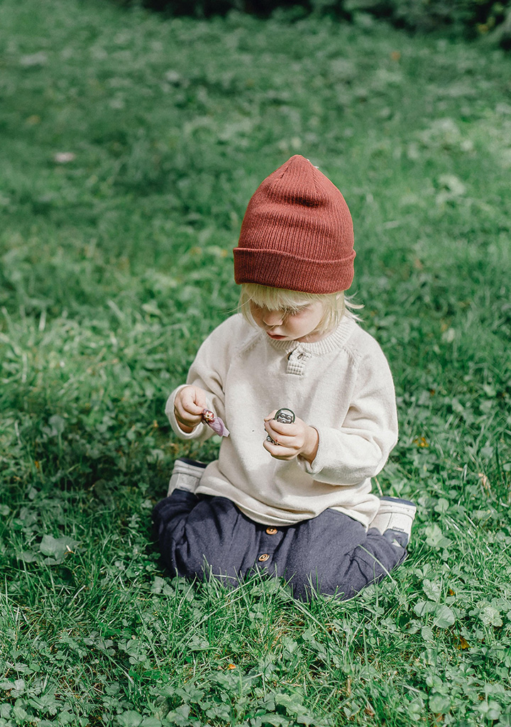 Female toddler playing in grass